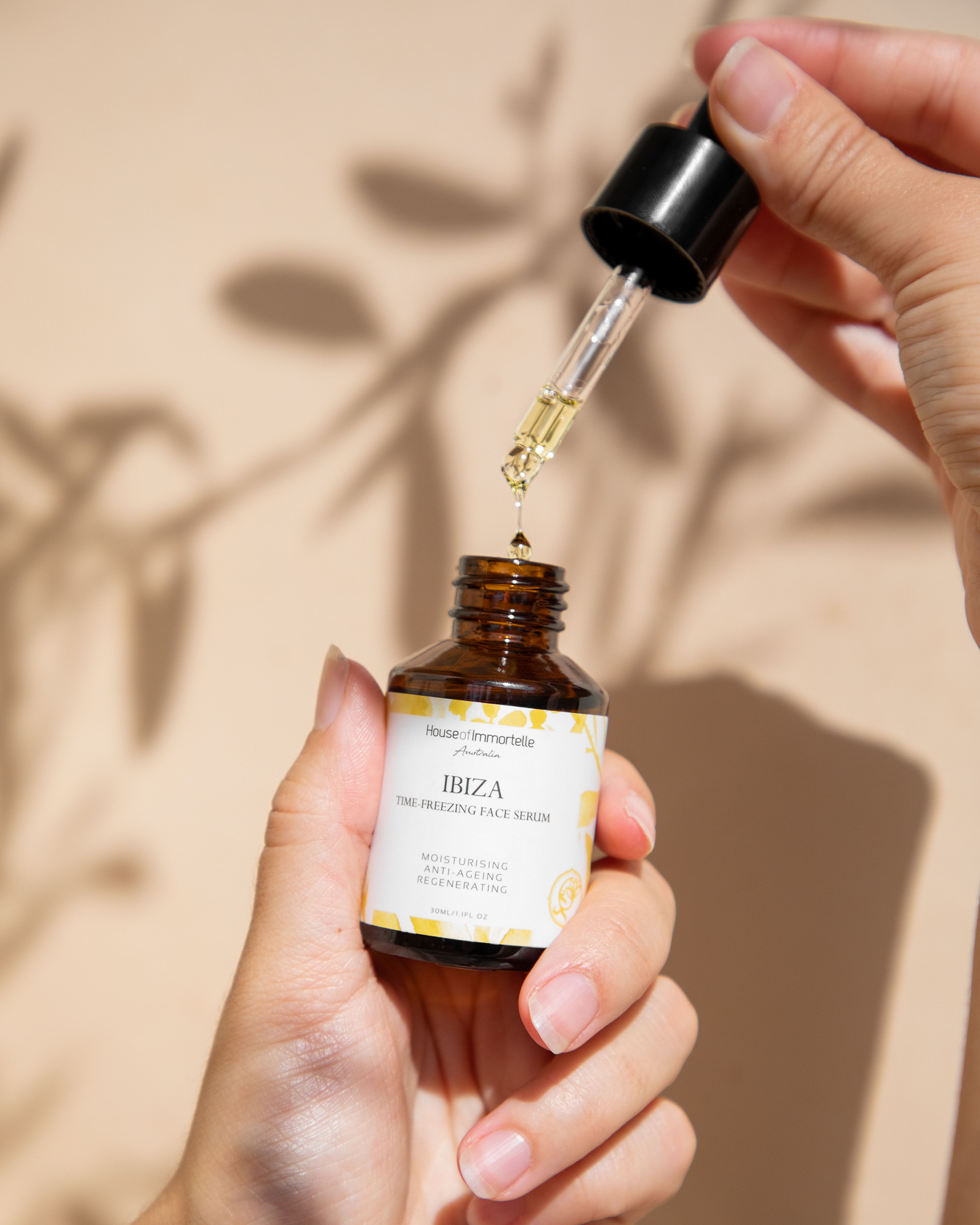 House of Immortelle Ibiza Time Freezing Face Serum in a sophisticated bottle, designed to reduce the appearance of fine lines and wrinkles. This lightweight serum is infused with potent anti-aging ingredients, providing a smooth, rejuvenated complexion for a youthful glow