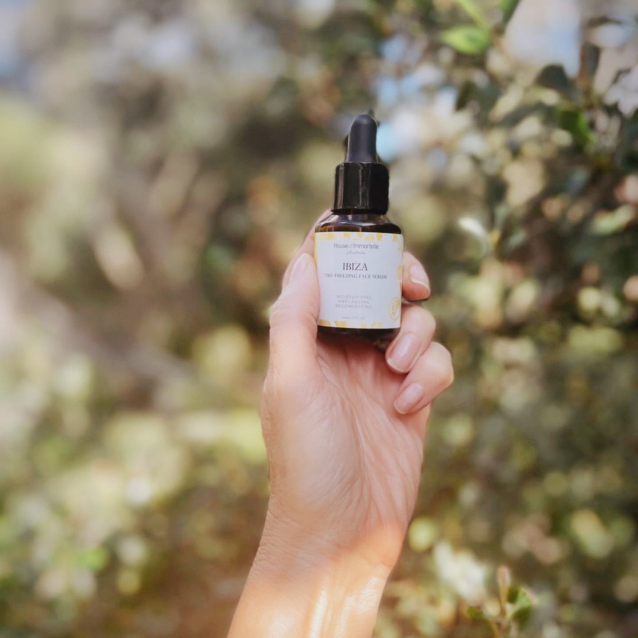 House of Immortelle Ibiza Time Freezing Face Serum in a sophisticated bottle, designed to reduce the appearance of fine lines and wrinkles. This lightweight serum is infused with potent anti-aging ingredients, providing a smooth, rejuvenated complexion for a youthful glow