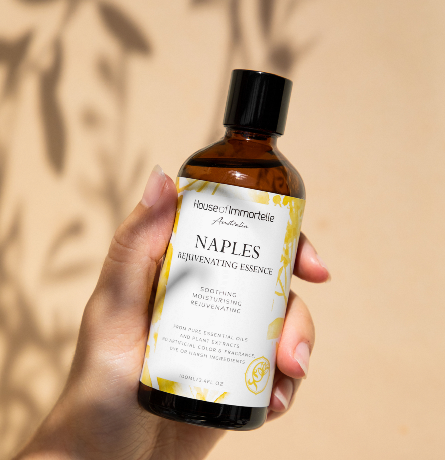House of Immortelle Naples Rejuvenating Essence in an elegant bottle, designed to hydrate and revitalize the skin. Infused with nourishing ingredients, this essence promotes a smoother, more youthful complexion, giving the skin a refreshed and rejuvenated appearance
