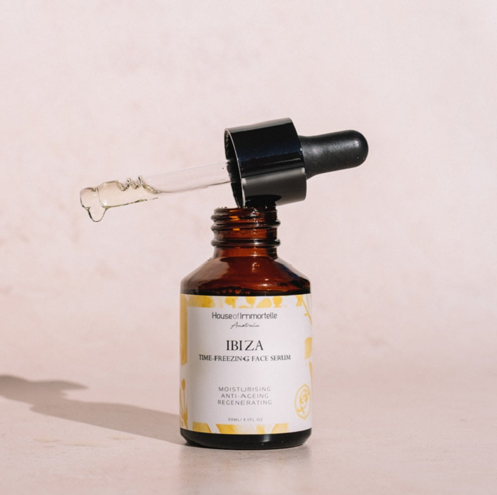 House of Immortelle Ibiza Time Freezing Face Serum in a sophisticated bottle, designed to reduce the appearance of fine lines and wrinkles. This lightweight serum is infused with potent anti-aging ingredients, providing a smooth, rejuvenated complexion for a youthful glow