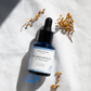 House of Immortelle B5 Immortelle Anti-Wrinkle Serum in an elegant bottle, enriched with Immortelle flower extract and vitamin B5 to reduce the appearance of fine lines and wrinkles. This lightweight serum helps to smooth, hydrate, and rejuvenate the skin for a more youthful complexion