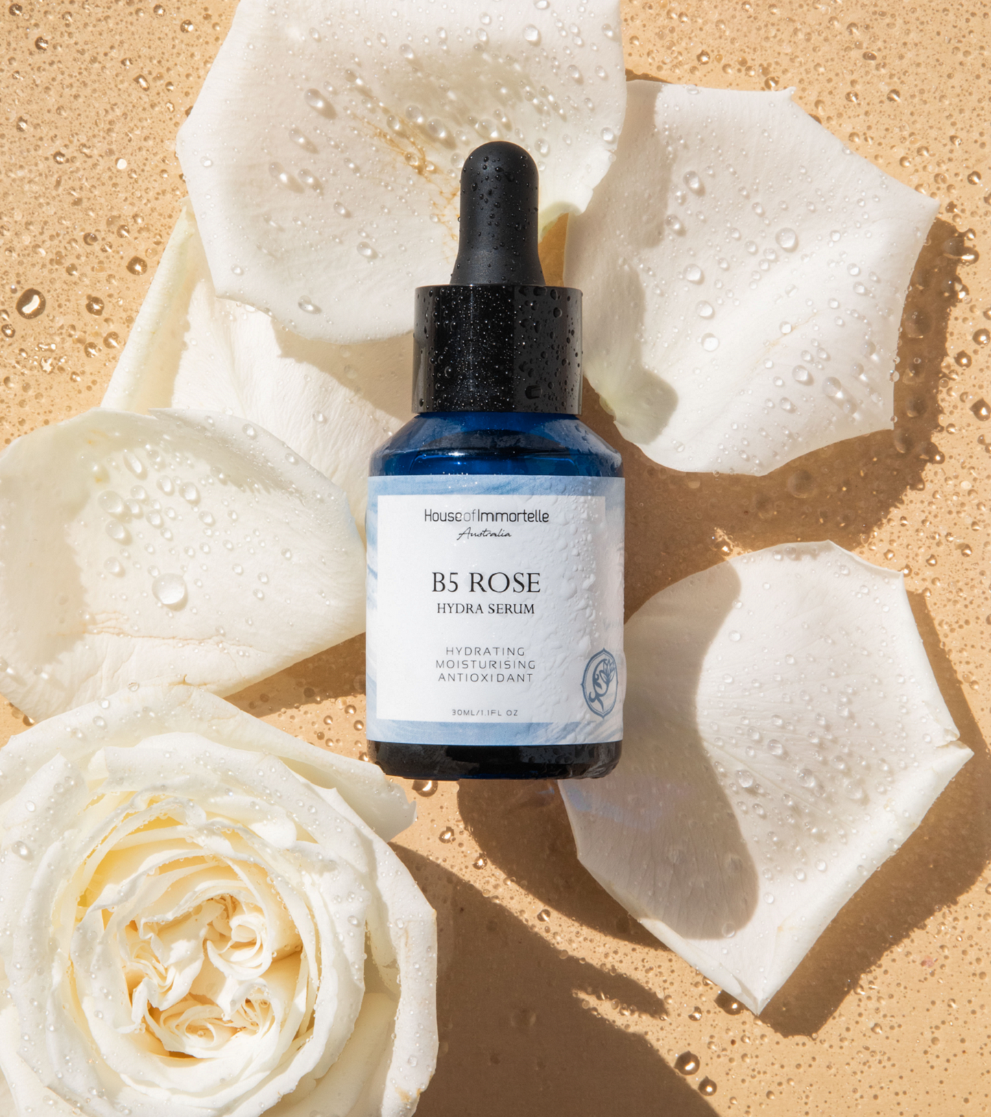 House of Immortelle B5 Rose Hydra Serum bottle with a sleek design and dropper cap. The serum is designed to deeply hydrate and soothe the skin, enriched with Vitamin B5 and rose extracts for a refreshed and radiant complexion