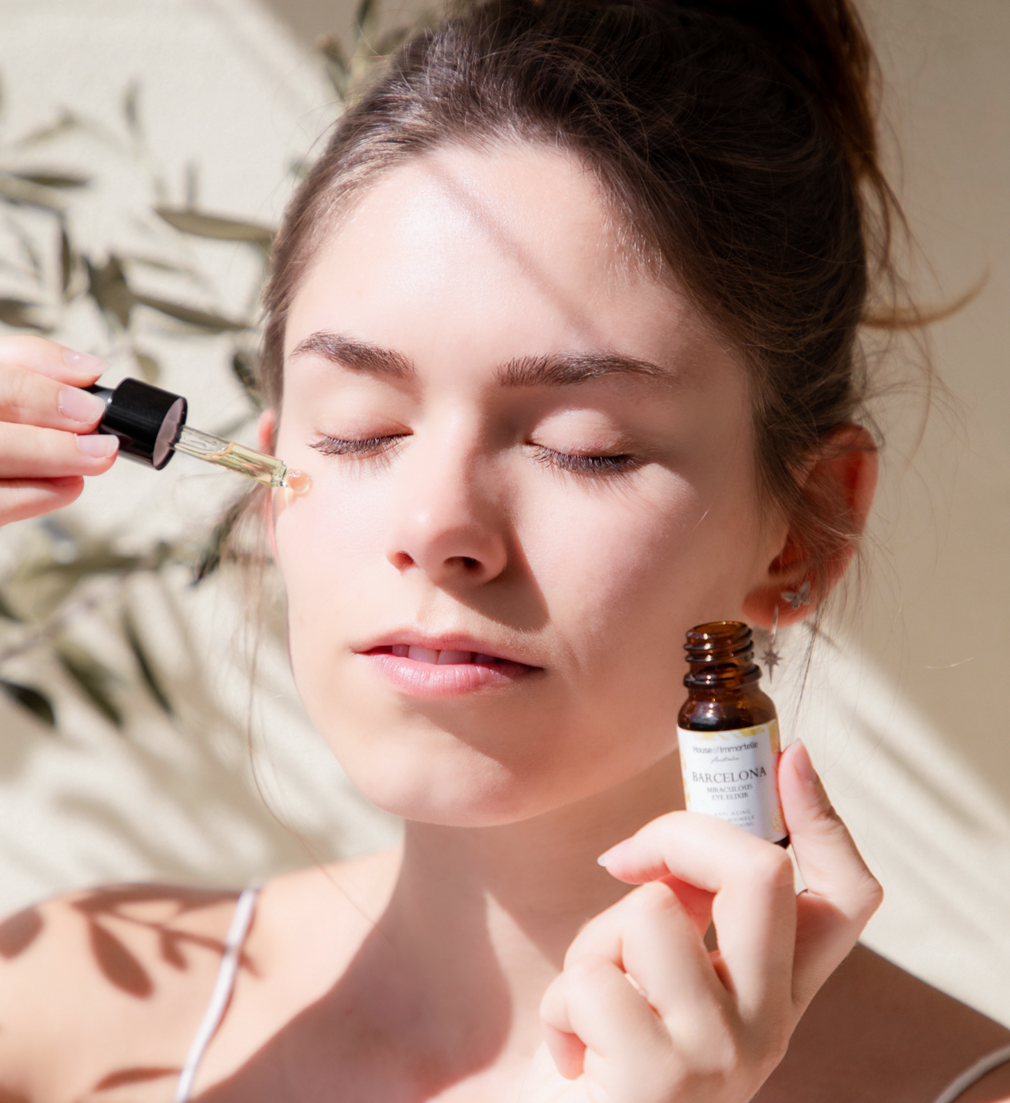 A rejuvenating Barcelona Miraculous Eye Elixir by House of Immortelle, formulated to reduce puffiness, dark circles, and fine lines around the delicate eye area. Its lightweight, soothing formula refreshes and revitalizes, leaving the eyes looking brighter and more youthful. Packaged in an elegant, travel-friendly bottle for daily use