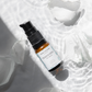 A potent Tightening Eye Cream by House of Immortelle, formulated to firm and smooth the delicate skin around the eyes. This rich cream helps reduce the appearance of fine lines, puffiness, and dark circles, leaving the eyes looking rejuvenated and refreshed. Packaged in a luxurious container for daily use.