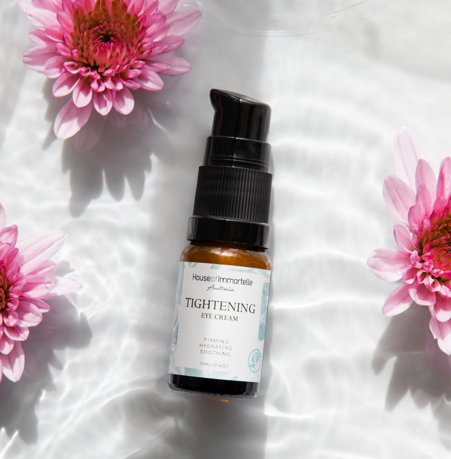 A potent Tightening Eye Cream by House of Immortelle, formulated to firm and smooth the delicate skin around the eyes. This rich cream helps reduce the appearance of fine lines, puffiness, and dark circles, leaving the eyes looking rejuvenated and refreshed. Packaged in a luxurious container for daily use.