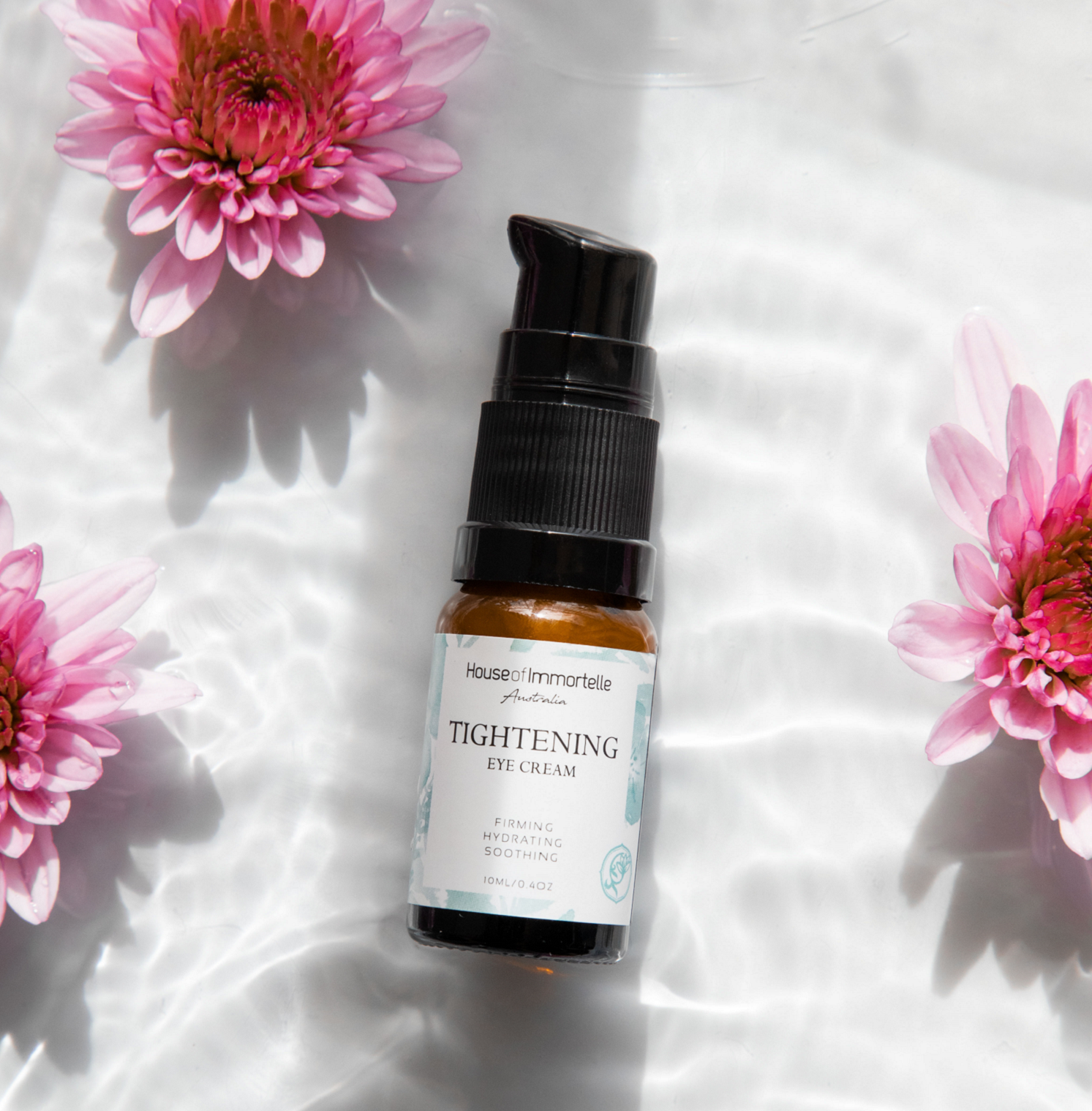 A potent Tightening Eye Cream by House of Immortelle, formulated to firm and smooth the delicate skin around the eyes. This rich cream helps reduce the appearance of fine lines, puffiness, and dark circles, leaving the eyes looking rejuvenated and refreshed. Packaged in a luxurious container for daily use.