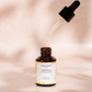 House of Immortelle Valencia Heavenly Face Serum in a sleek, elegant bottle, featuring a lightweight formula designed to hydrate and nourish the skin. The serum is infused with natural ingredients, offering a glowing, refreshed complexion, and is ideal for daily skincare routines