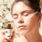 House of Immortelle Valencia Heavenly Face Serum in a sleek, elegant bottle, featuring a lightweight formula designed to hydrate and nourish the skin. The serum is infused with natural ingredients, offering a glowing, refreshed complexion, and is ideal for daily skincare routines