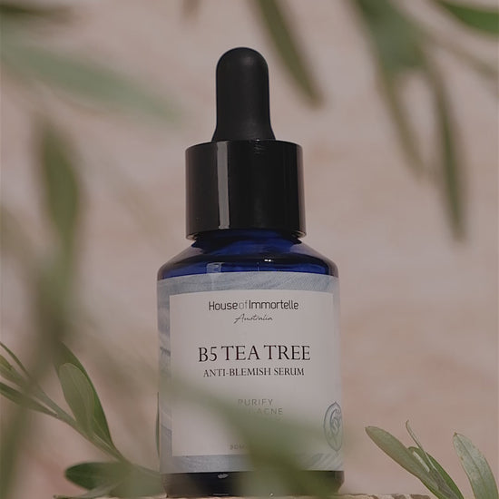 House of Immortelle B5 Tea Tree Anti-Blemish Serum in a sleek bottle, formulated with tea tree oil and vitamin B5 to target blemishes and soothe the skin. This lightweight serum helps reduce the appearance of acne and blemishes, leaving the skin clear and balanced