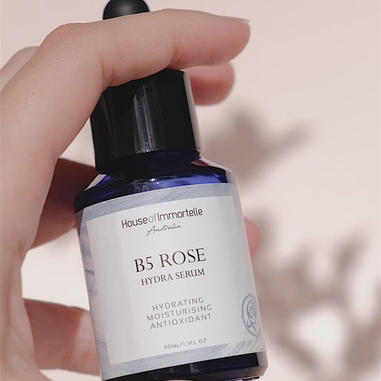 House of Immortelle B5 Rose Hydra Serum bottle with a sleek design and dropper cap. The serum is designed to deeply hydrate and soothe the skin, enriched with Vitamin B5 and rose extracts for a refreshed and radiant complexion.