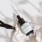 House of Immortelle B5 Immortelle Anti-Wrinkle Serum in an elegant bottle, enriched with Immortelle flower extract and vitamin B5 to reduce the appearance of fine lines and wrinkles. This lightweight serum helps to smooth, hydrate, and rejuvenate the skin for a more youthful complexion