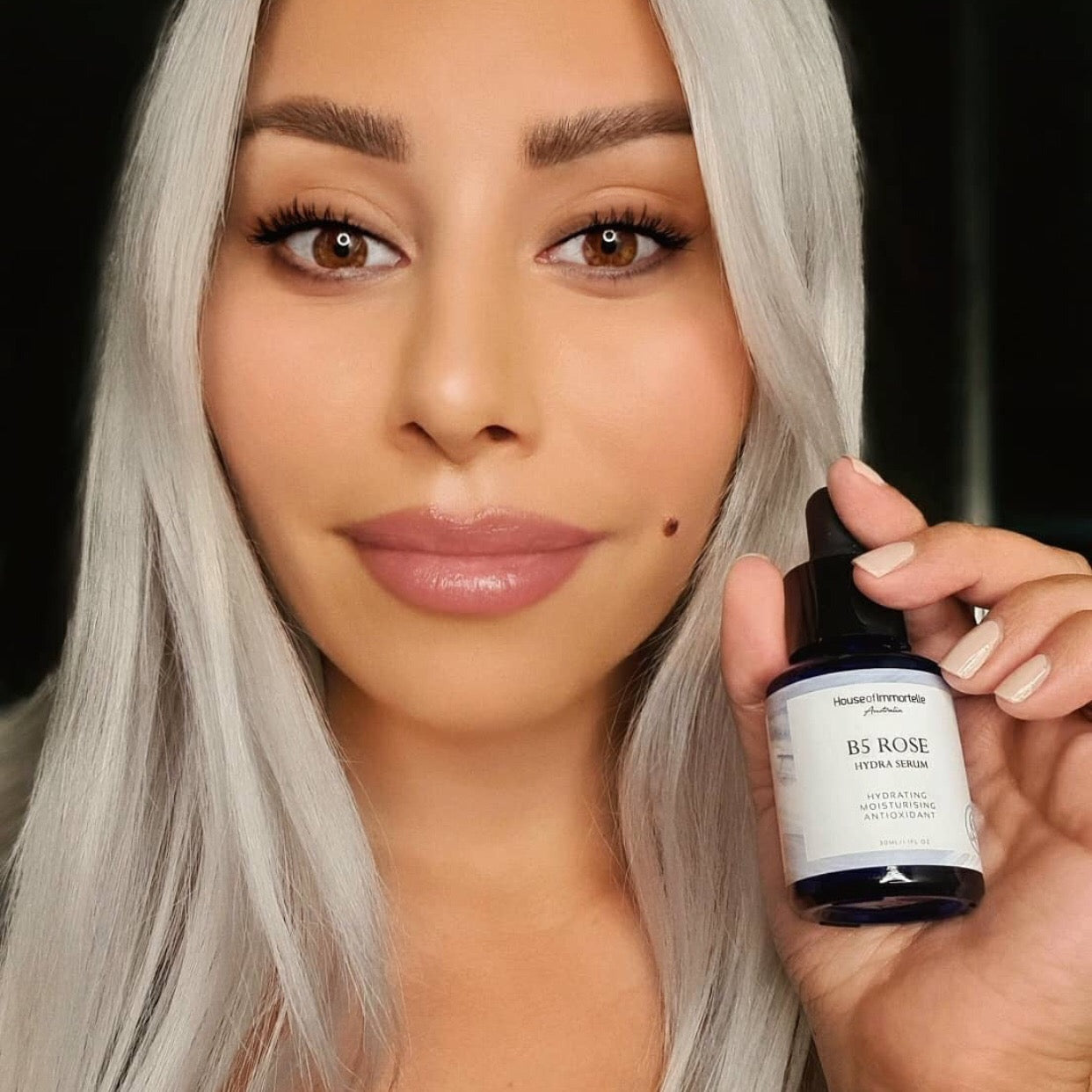 House of Immortelle B5 Rose Hydra Serum bottle with a sleek design and dropper cap. The serum is designed to deeply hydrate and soothe the skin, enriched with Vitamin B5 and rose extracts for a refreshed and radiant complexion