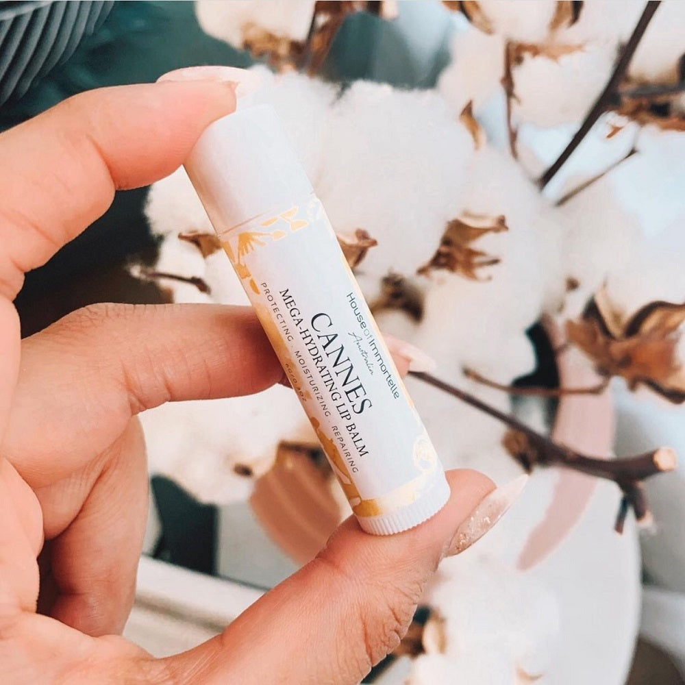 A nourishing Cannes Mega Hydrating Lip Balm by House of Immortelle, designed to deeply hydrate and protect the lips. Its rich formula provides long-lasting moisture, leaving lips soft, smooth, and supple. The sleek, portable packaging makes it perfect for on-the-go hydration