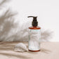 House of Immortelle Gentle Milky Cleanser in a smooth bottle, featuring a creamy formula designed to cleanse and hydrate the skin. This mild cleanser gently removes impurities while nourishing, leaving the skin soft, refreshed, and balanced