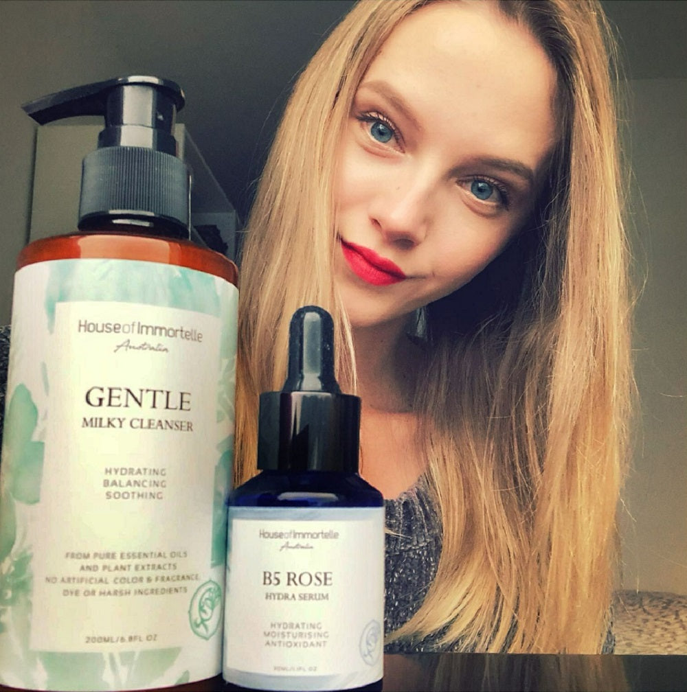 House of Immortelle Gentle Milky Cleanser in a smooth bottle, featuring a creamy formula designed to cleanse and hydrate the skin. This mild cleanser gently removes impurities while nourishing, leaving the skin soft, refreshed, and balanced