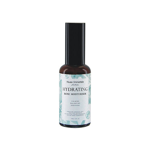 House of Immortelle Hydrating Rose Moisturiser in a sleek jar, featuring a creamy, smooth texture. The product is enriched with rose extract to hydrate and nourish the skin, surrounded by soft rose petals, emphasizing its natural and luxurious ingredients