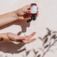 House of Immortelle Lavender Hand Sanitiser in a sleek bottle, featuring a calming lavender scent. The sanitiser is designed to cleanse and refresh hands while leaving a soothing fragrance, with a minimalist label and a clear bottle highlighting its premium quality.