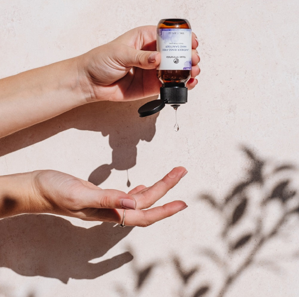 House of Immortelle Lavender Hand Sanitiser in a sleek bottle, featuring a calming lavender scent. The sanitiser is designed to cleanse and refresh hands while leaving a soothing fragrance, with a minimalist label and a clear bottle highlighting its premium quality.