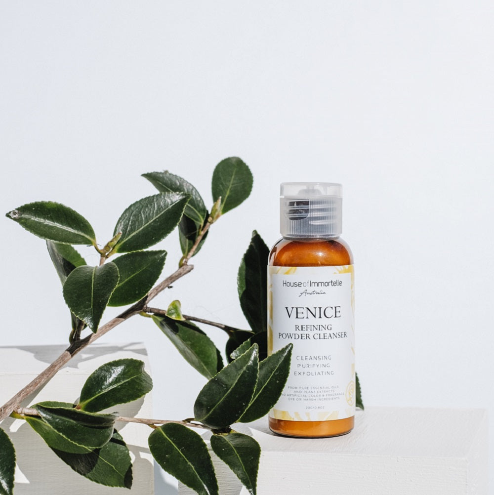 A refined Venice Refining Powder Cleanser by House of Immortelle, a gentle yet effective formula that transforms into a soft foam when mixed with water. This powder cleanser exfoliates and purifies the skin, leaving it smooth, bright, and refreshed. The elegant packaging makes it perfect for a luxurious skincare routine