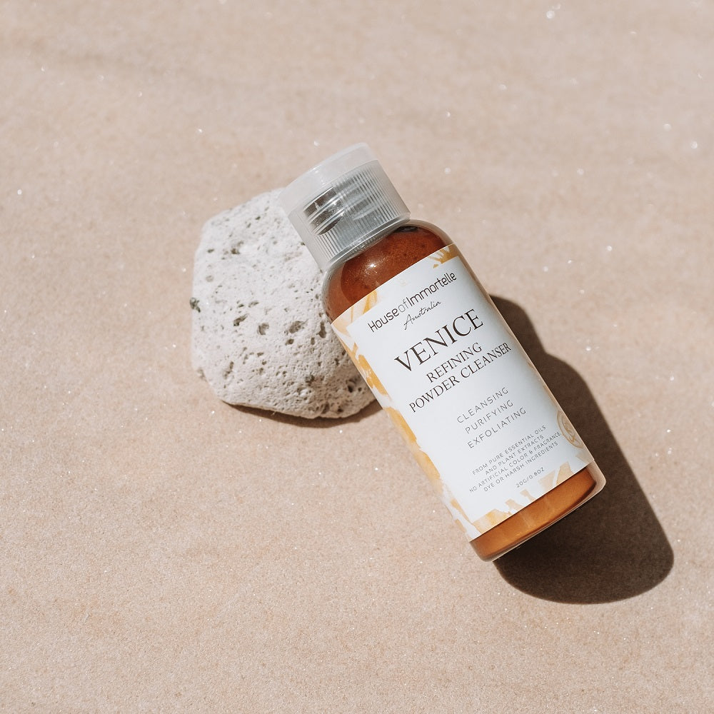 A refined Venice Refining Powder Cleanser by House of Immortelle, a gentle yet effective formula that transforms into a soft foam when mixed with water. This powder cleanser exfoliates and purifies the skin, leaving it smooth, bright, and refreshed. The elegant packaging makes it perfect for a luxurious skincare routine